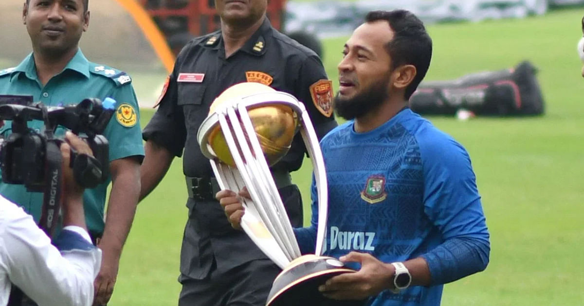 Bangladesh cricketers pose with their dream trophy