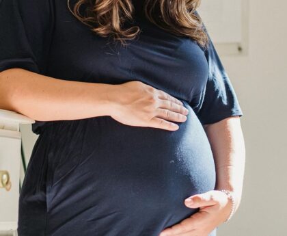 How is obesity a risk factor for stillbirth?